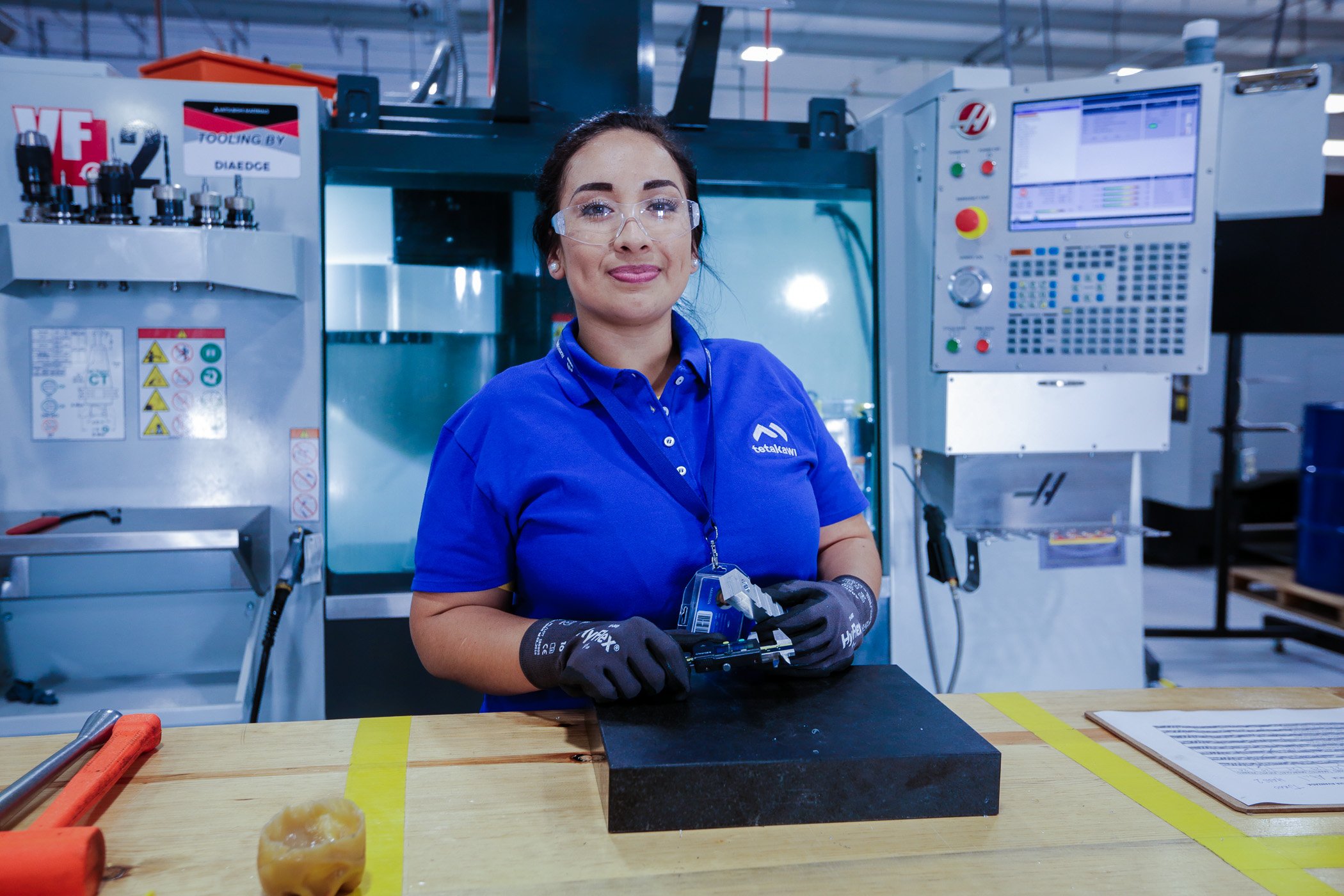 Girl learning to be CNC operator for aerospace company in Mexico