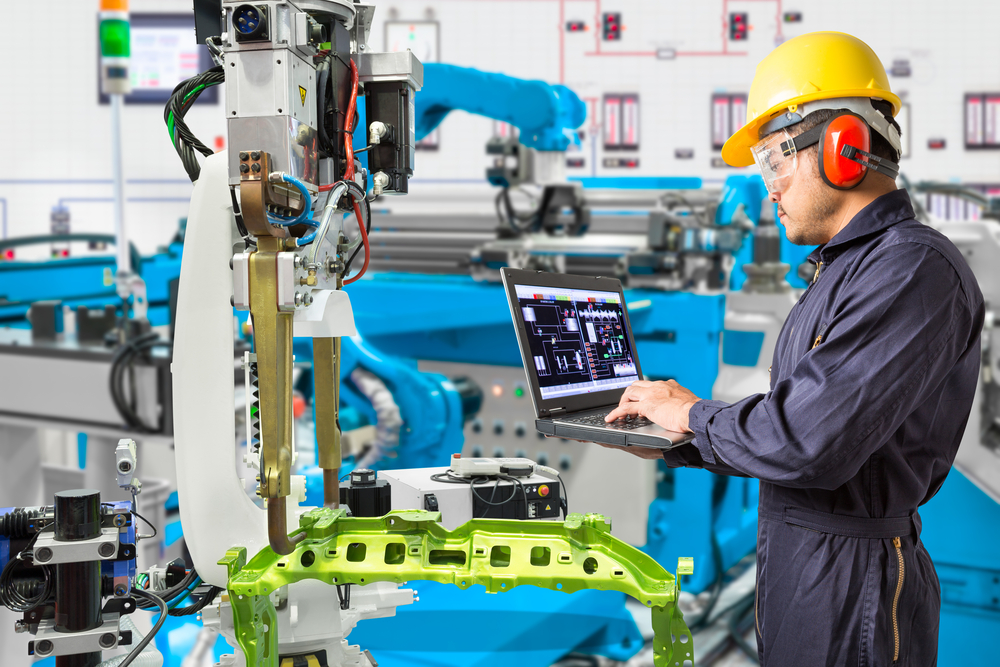 Autotmotive Manufacturing Worker Using Automated Machine