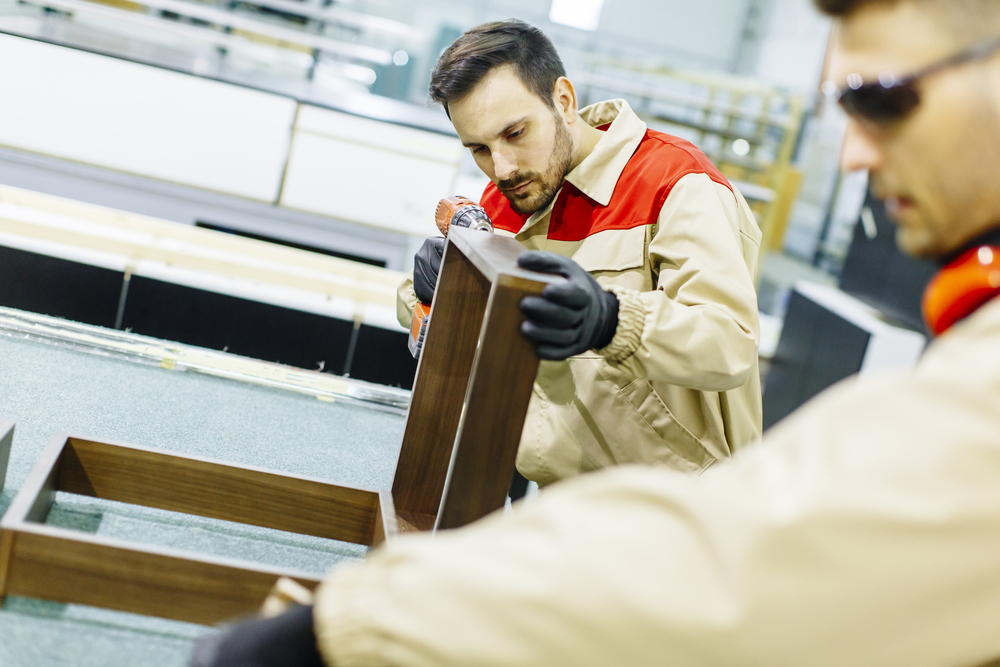 Employees working in a cabinet manufacturing facility in Mexico